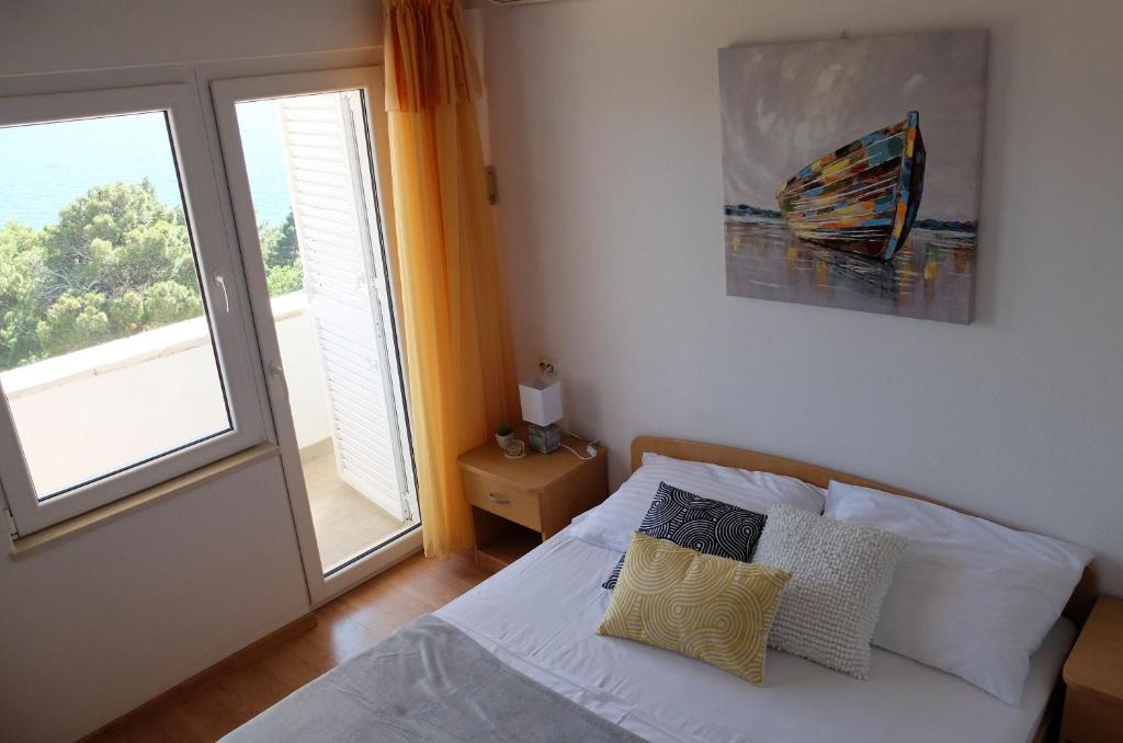 Postel nebo postele na pokoji v ubytování Villa Ljetni San