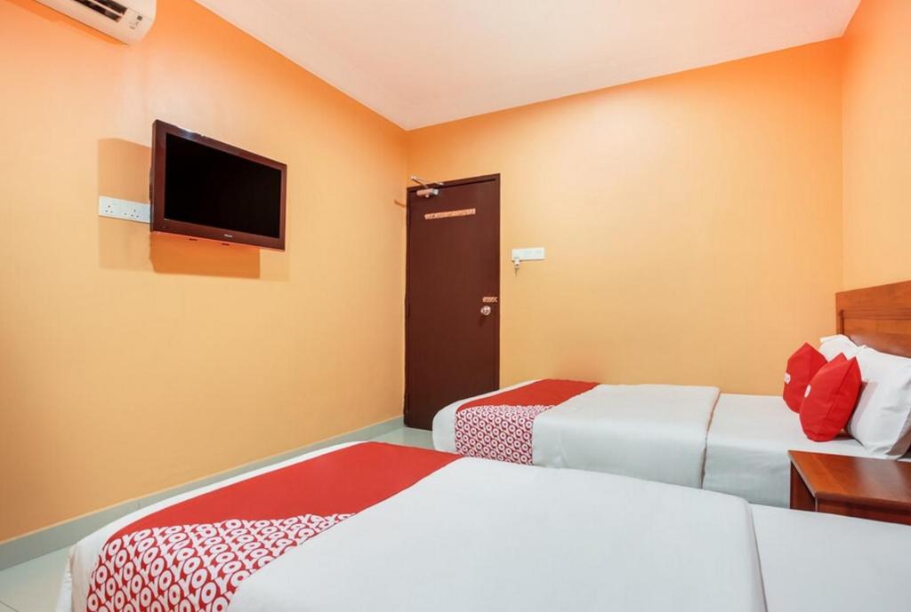 Postel nebo postele na pokoji v ubytování My Town Hotel