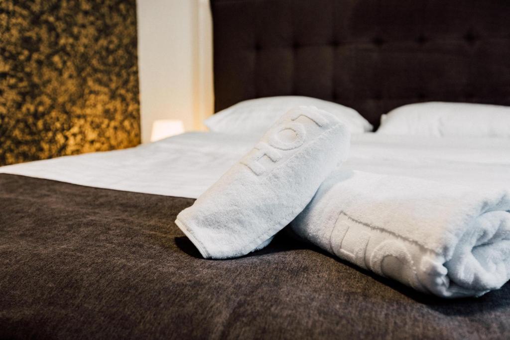 Postel nebo postele na pokoji v ubytování Hotel Livnica