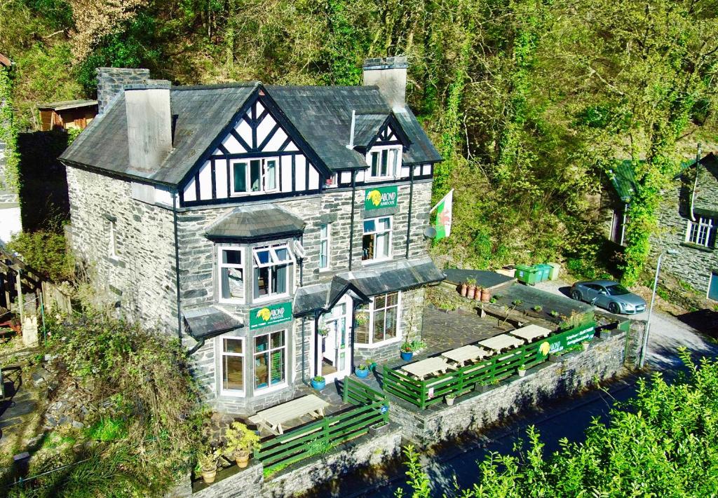 an aerial view of a house in the water at The Vagabond Bunkhouse in Betws-y-coed