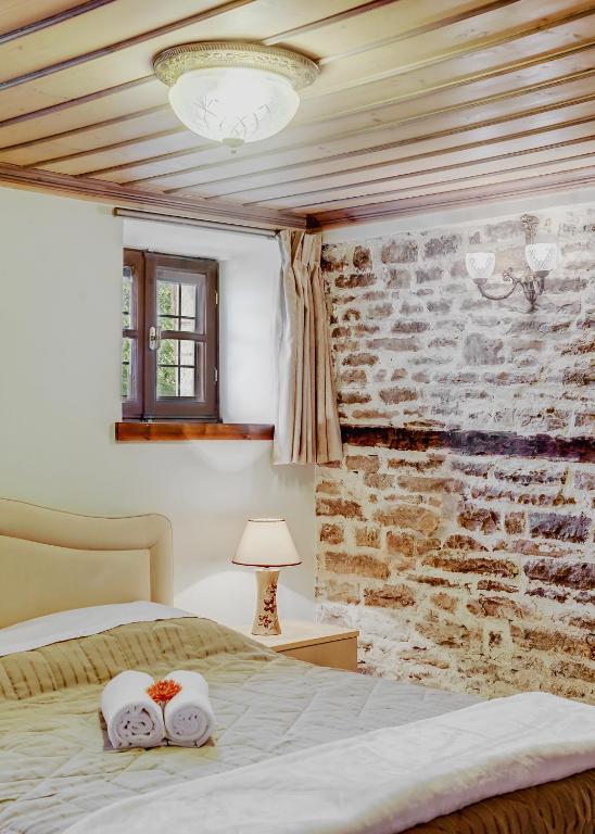 Postel nebo postele na pokoji v ubytování Archontiko Evridikis