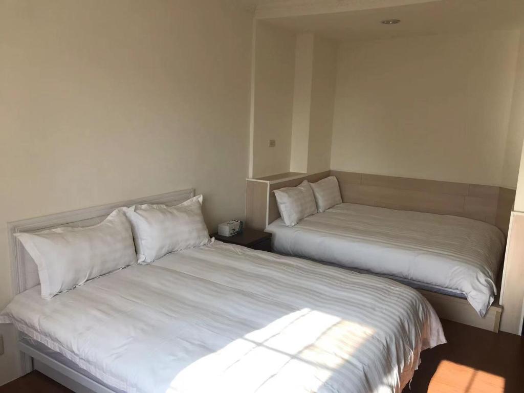 Llit o llits en una habitació de Red Roof B&B