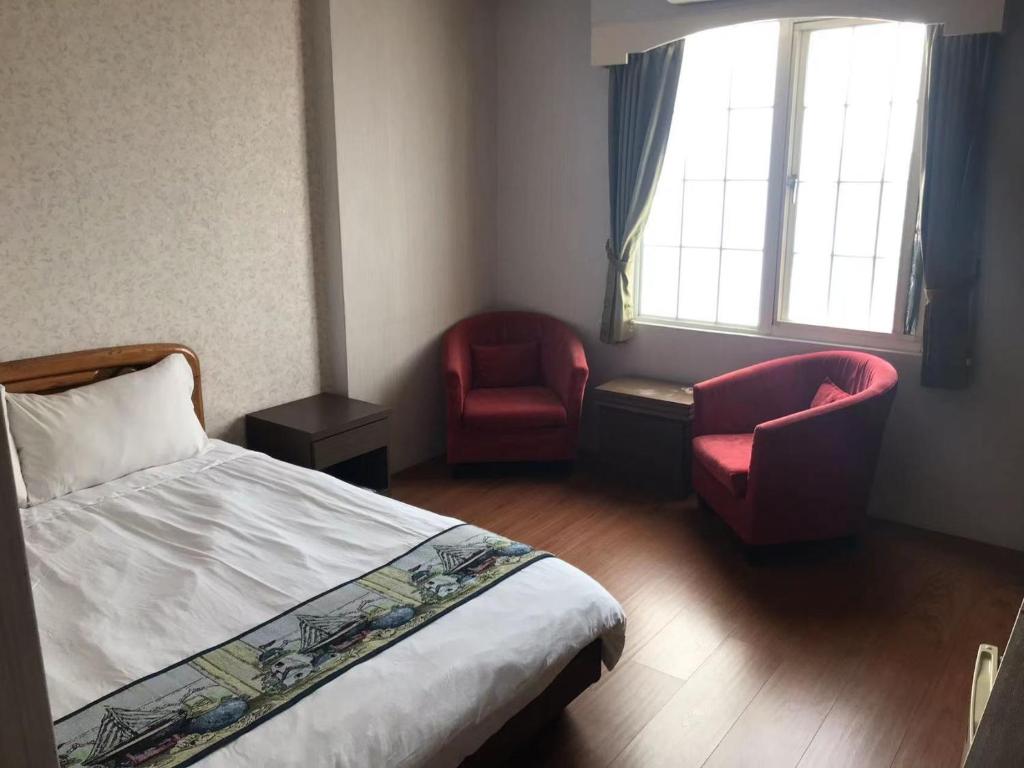 Postel nebo postele na pokoji v ubytování Red Roof B&B