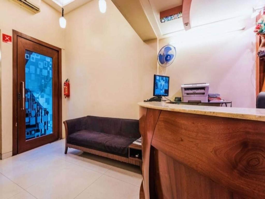 TV a/nebo společenská místnost v ubytování Hotel Broadway Colaba