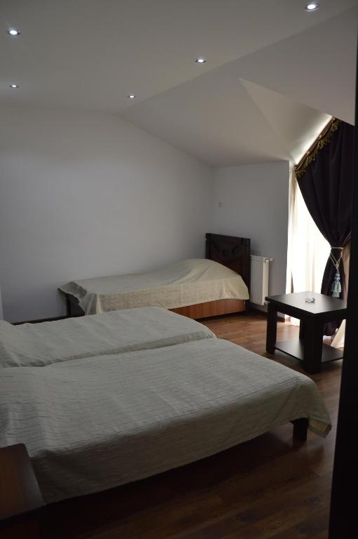 Postel nebo postele na pokoji v ubytování Hotel Bagineti