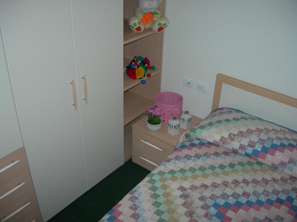 Postel nebo postele na pokoji v ubytování Appartamenti Vacanze Casa -Residence Albare - check in Vacanze Casa - Marilleva 900