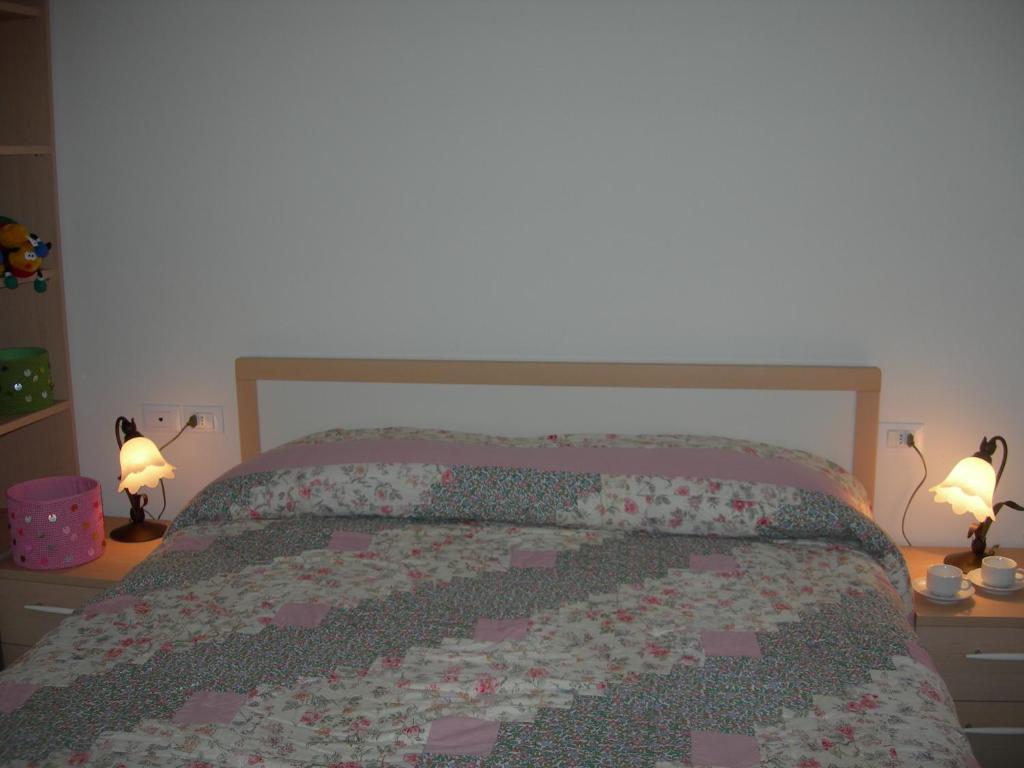 Postel nebo postele na pokoji v ubytování Appartamenti Vacanze Casa -Residence Albare - check in Vacanze Casa - Marilleva 900