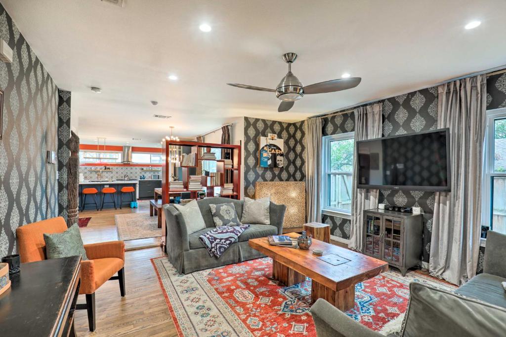 a living room with a couch and a table at Eclectic Austin Bungalow Central Location! in Austin