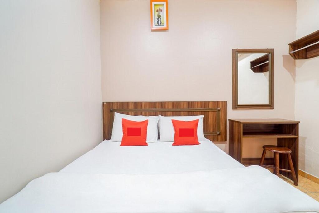 Postel nebo postele na pokoji v ubytování Hill Times Inn Hotel