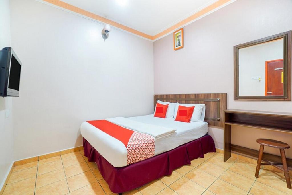 Postel nebo postele na pokoji v ubytování Hill Times Inn Hotel