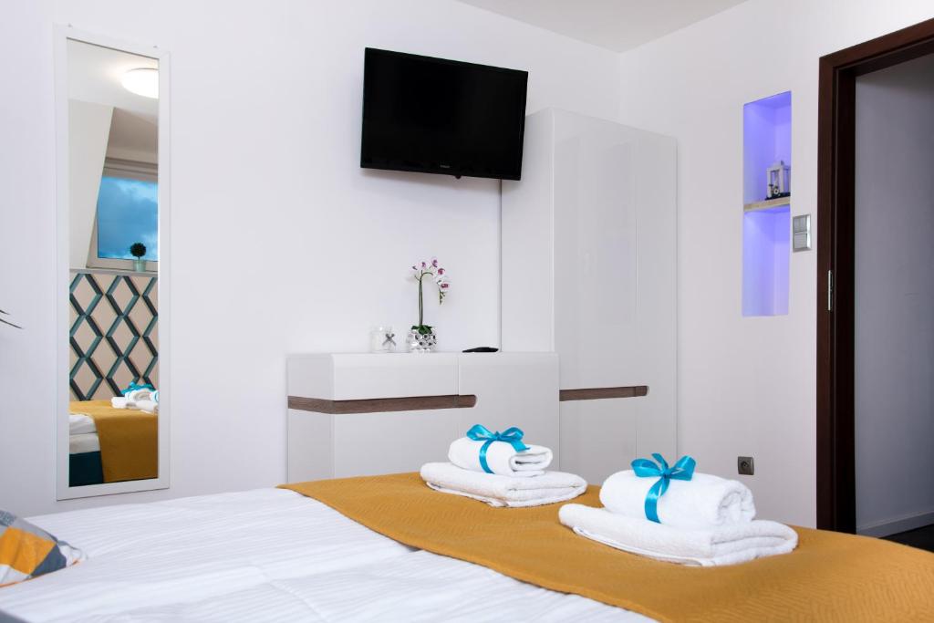 Postel nebo postele na pokoji v ubytování Apartamenty WIKTORIA morska18