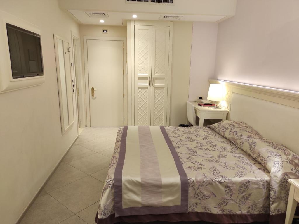 Postel nebo postele na pokoji v ubytování Corona D'Italia