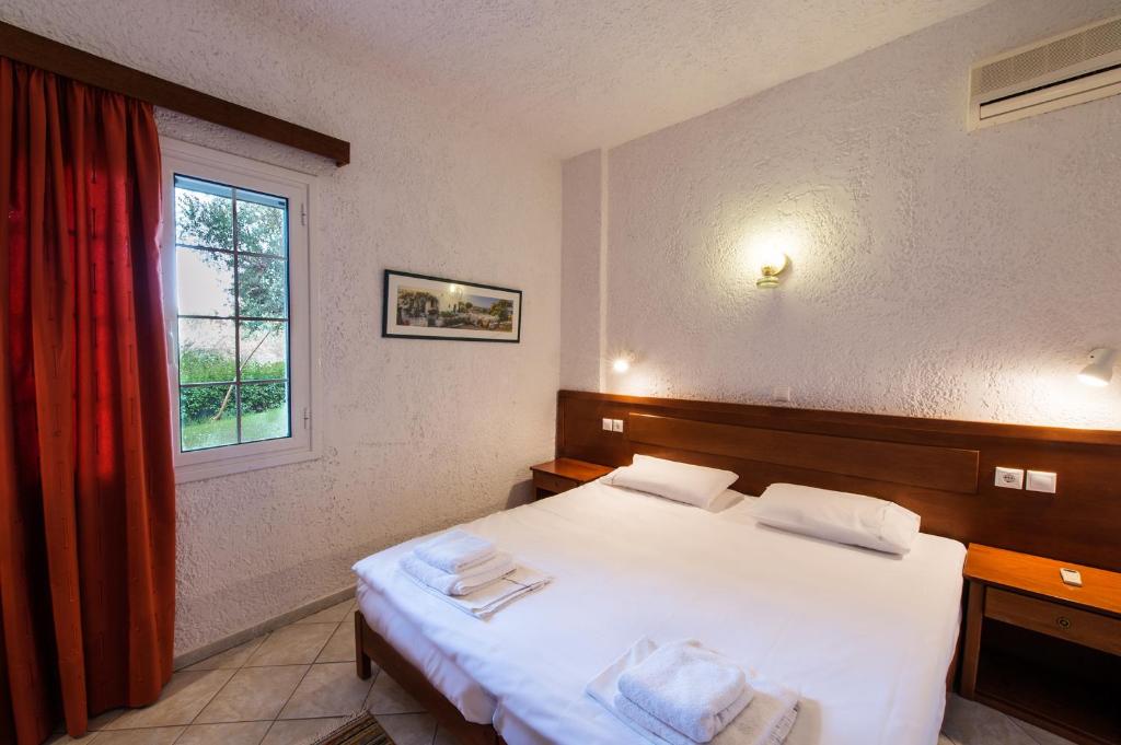 Posteľ alebo postele v izbe v ubytovaní Koroni Village