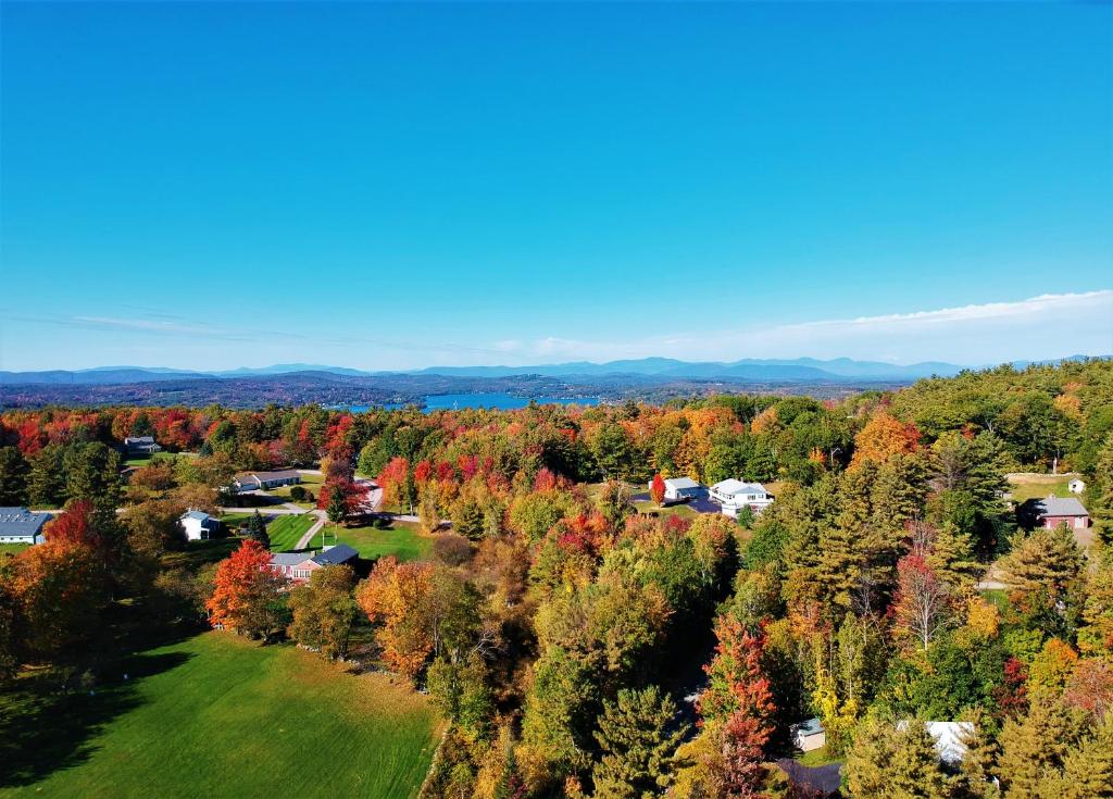an aerial view of a town with fall trees at Quiet Gilford Home with Hot tub - Winnipesaukee! in Gilford