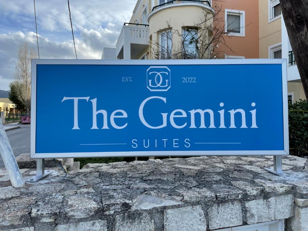 a blue sign for the gemini suites at The Gemini Suites in Kos Town