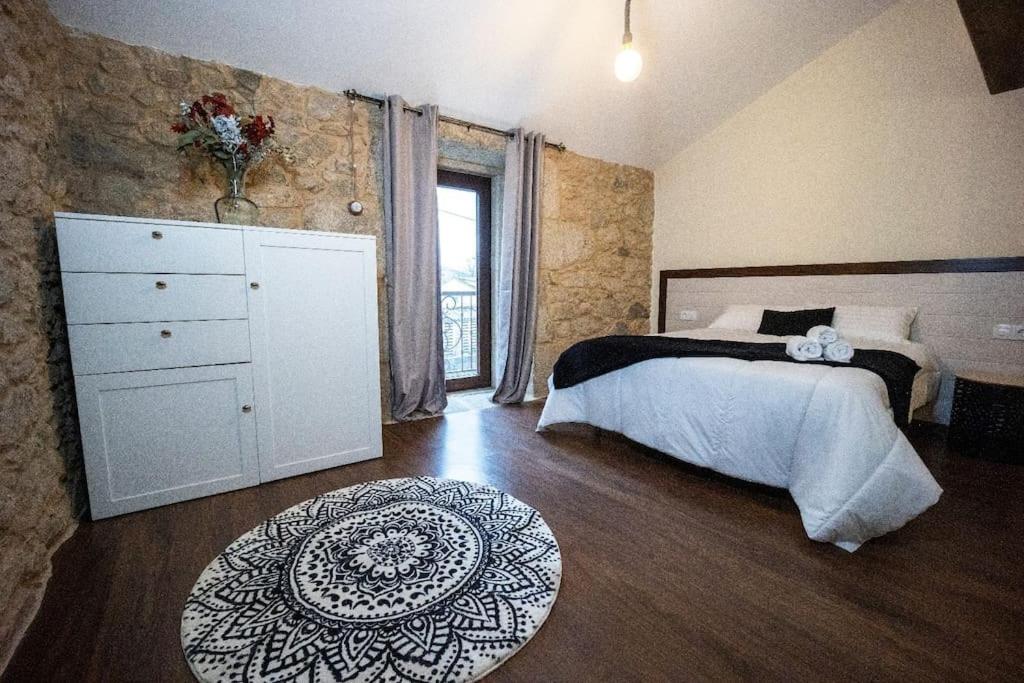 Posteľ alebo postele v izbe v ubytovaní A de Pepita, Turismo Rural en Padrón by URent
