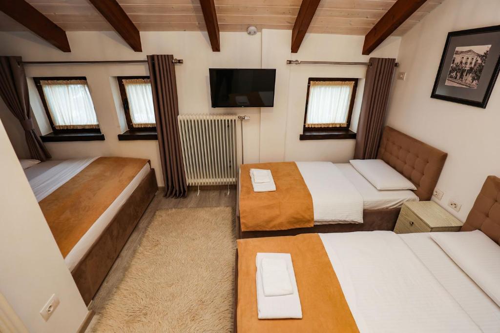 Postel nebo postele na pokoji v ubytování Bujtina Oxhaku