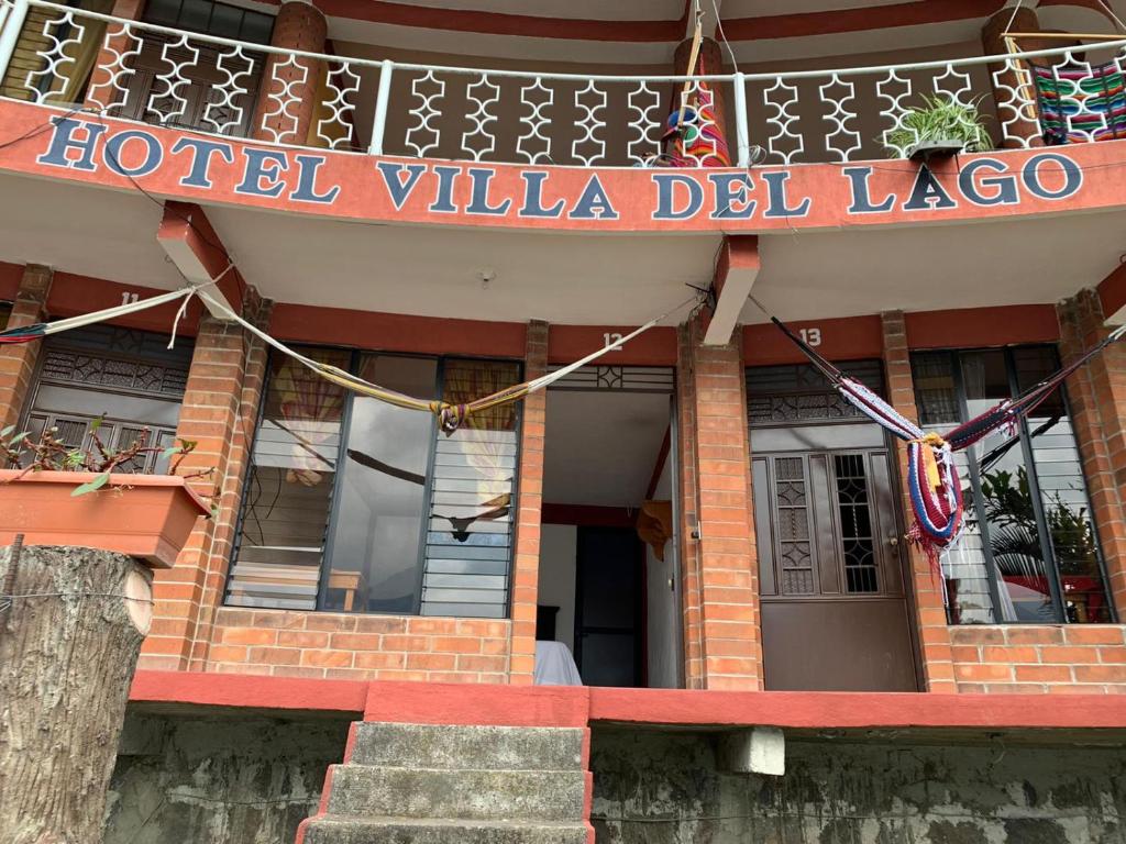 a hotel villa del lago sign on the front of a building at Hotel Villa del Lago, Gladys in San Pedro La Laguna