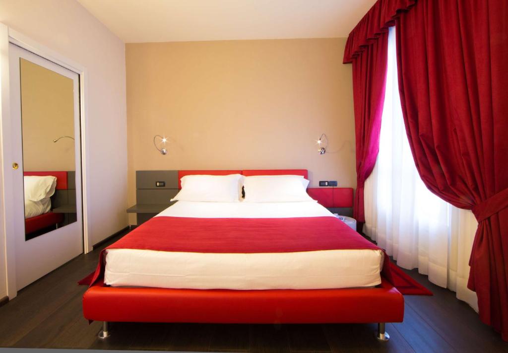 Postel nebo postele na pokoji v ubytování Best Western Hotel Genio