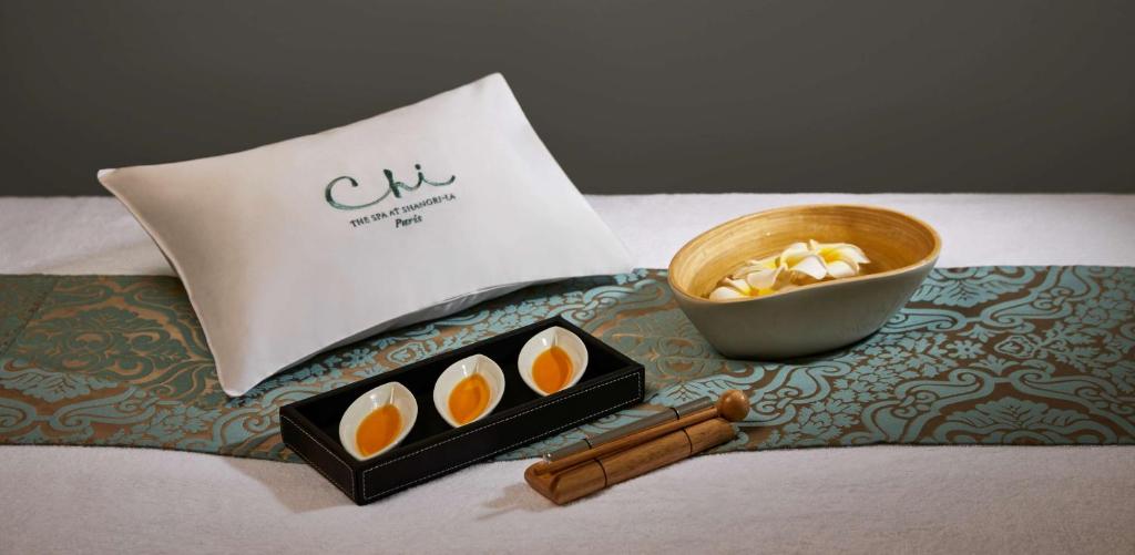 a tray with a box of eggs and a bowl of popcorn at Shangri-La Paris in Paris