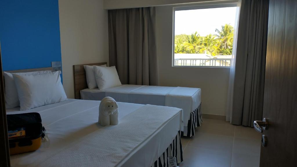 Postel nebo postele na pokoji v ubytování Ondas Praia Resort