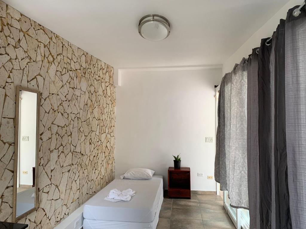 Voodi või voodid majutusasutuse Bodhi Panama City toas