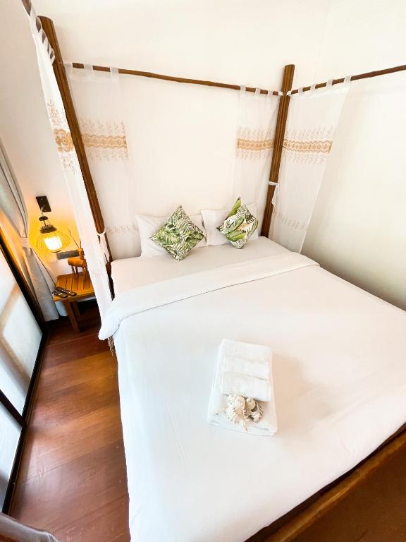 Postel nebo postele na pokoji v ubytování À La Koh Kood Resort