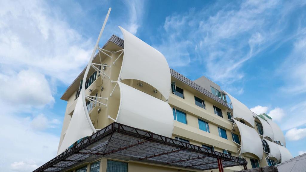 a building with a large white building at Sojourn Guest House Melaka in Malacca