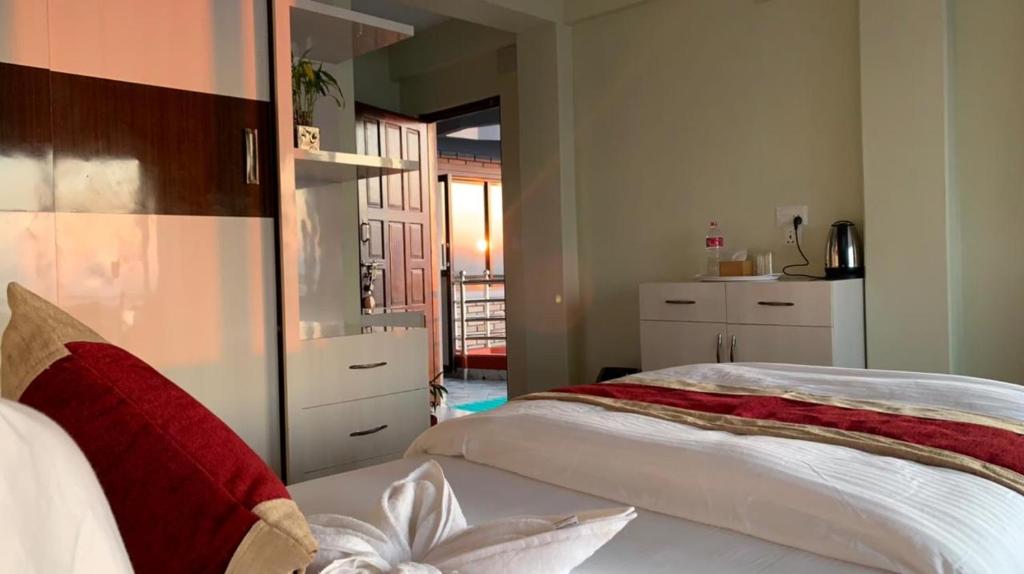 Llit o llits en una habitació de Hotel Pristine Himalaya