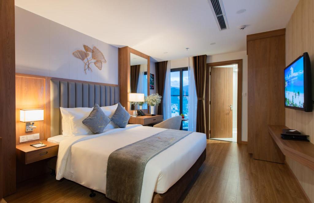 Postel nebo postele na pokoji v ubytování Grand Gosia Hotel