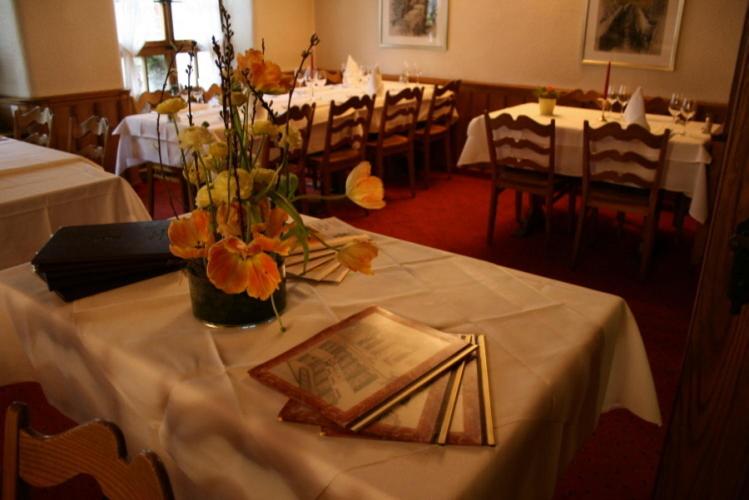 
a dining room table with a table cloth on it at Hotel zum alten Schweizer in Twann
