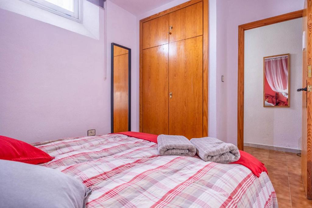 A bed or beds in a room at Alojamiento Rural Cuatro Estaciones