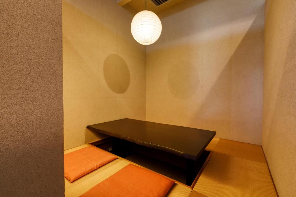 Postel nebo postele na pokoji v ubytování Yufuin Onsen Toshoan