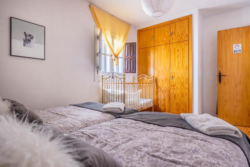 A bed or beds in a room at Alojamiento Rural Cuatro Estaciones