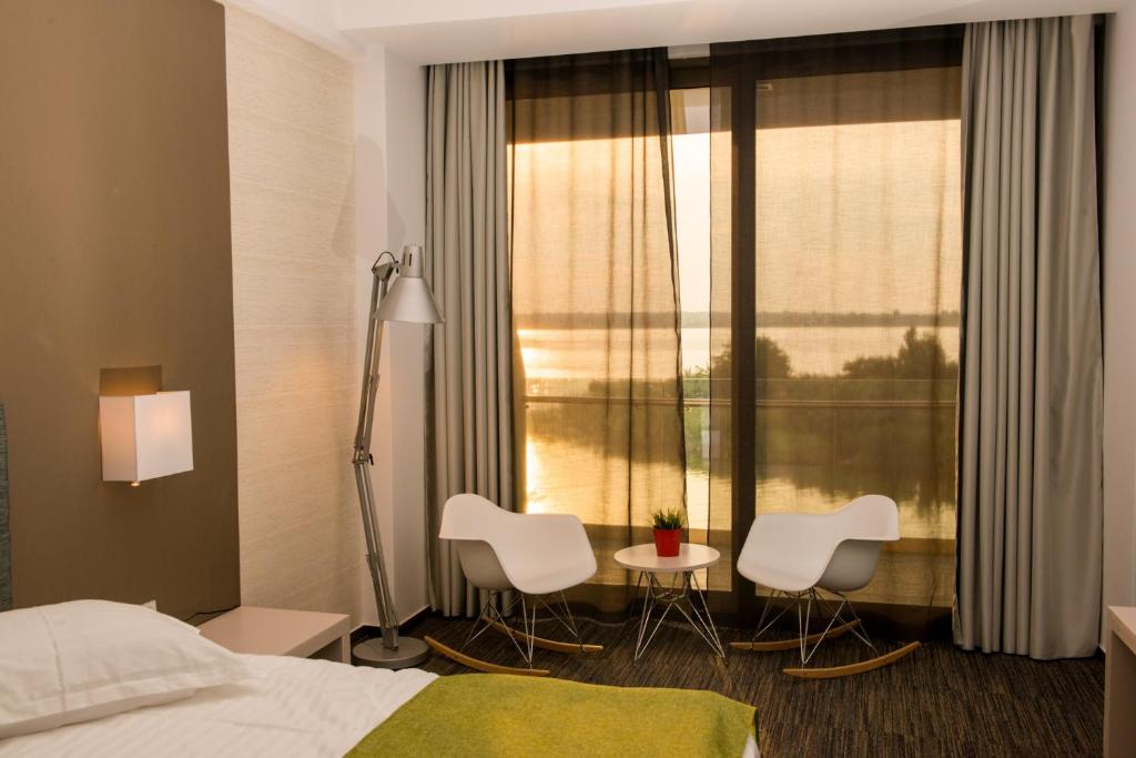 Postel nebo postele na pokoji v ubytování Hotel On Plonge Junior