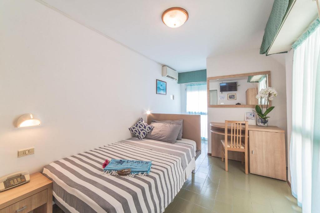 Postel nebo postele na pokoji v ubytování Blu Star Hotel