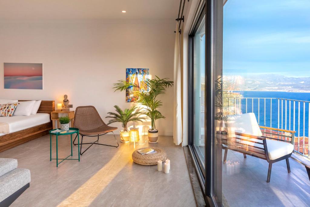 a living room with a view of the ocean at Born in Blue in Kaş