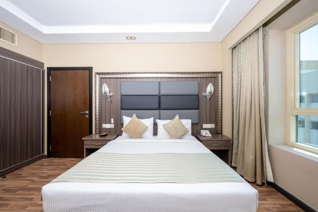 Postel nebo postele na pokoji v ubytování Pearl Swiss Hotel