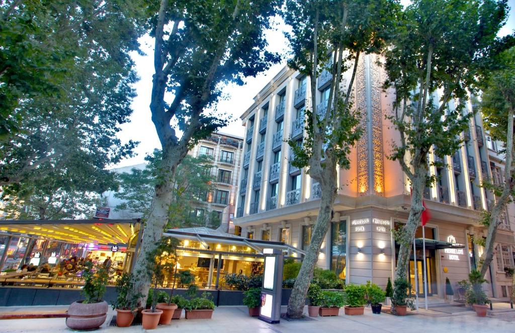 a city street with trees and a building at AHC Ayasofya Hotel in Istanbul