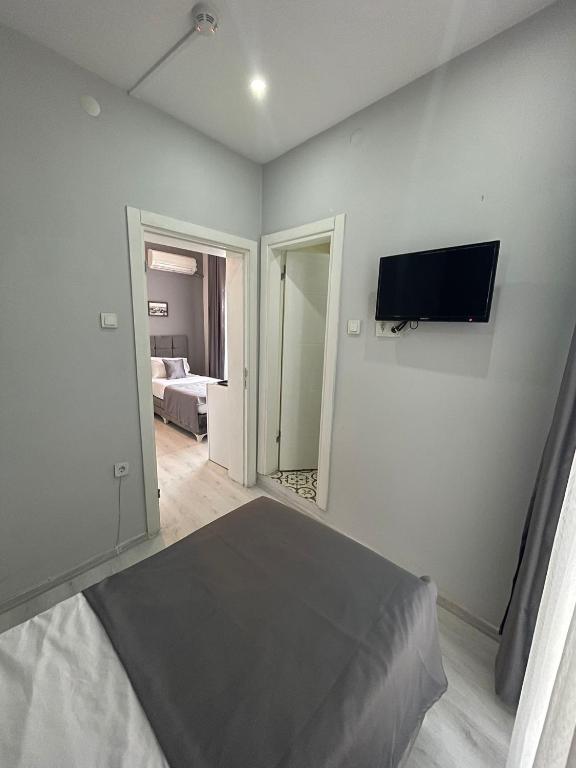 A bed or beds in a room at Oldmile Palace Hotel