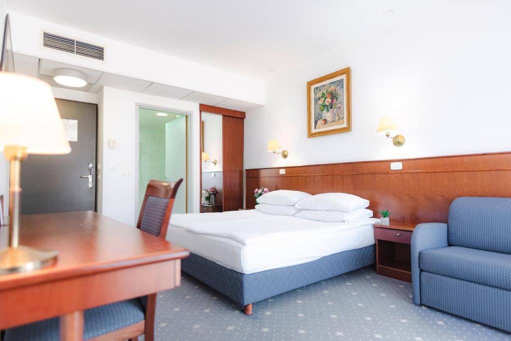 Postel nebo postele na pokoji v ubytování Hotel Čatež - Terme Čatež