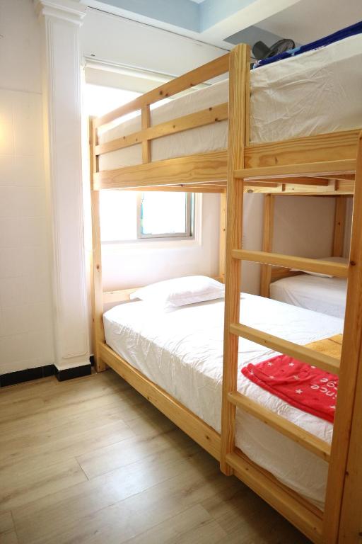 Voodi või voodid majutusasutuse Loan Võ hostel toas