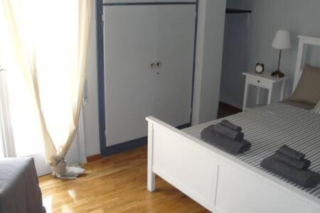 Łóżko lub łóżka w pokoju w obiekcie Illisia Roof Apartment