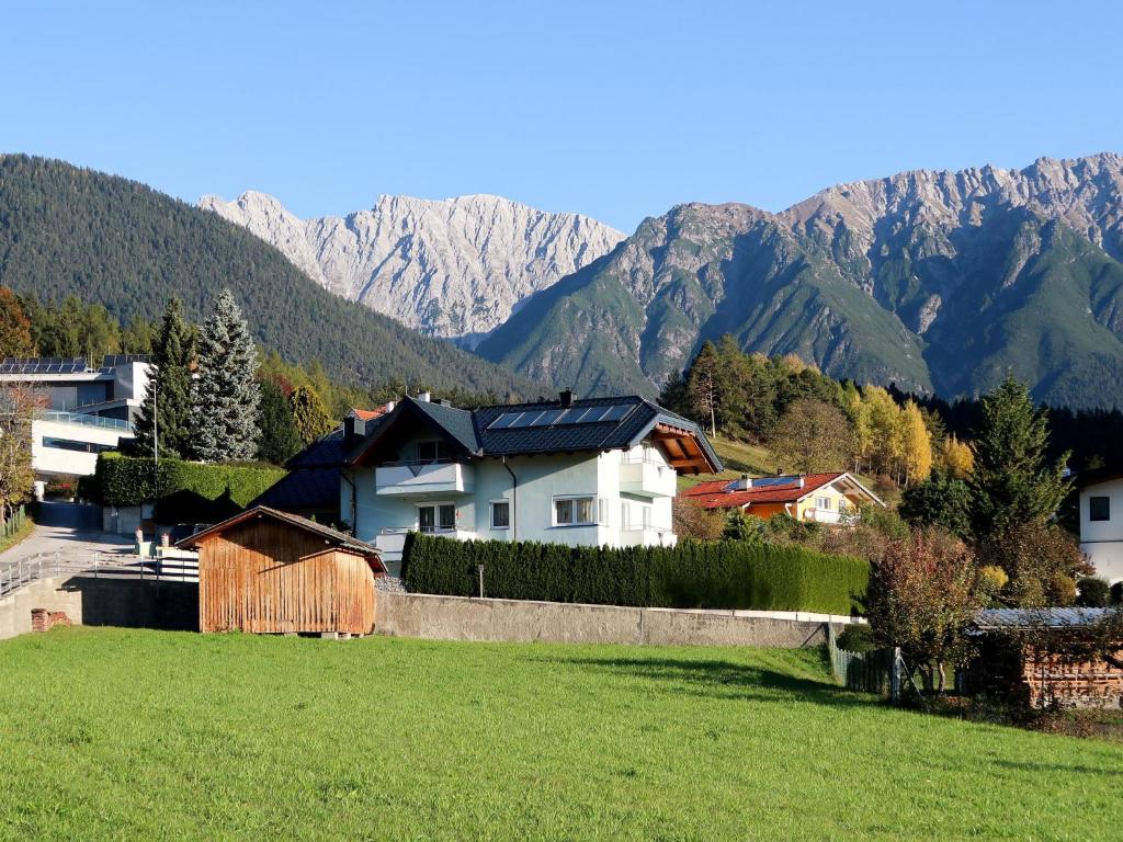 a group of houses with mountains in the background at Apartment Apartment Frisch by Interhome in Imst