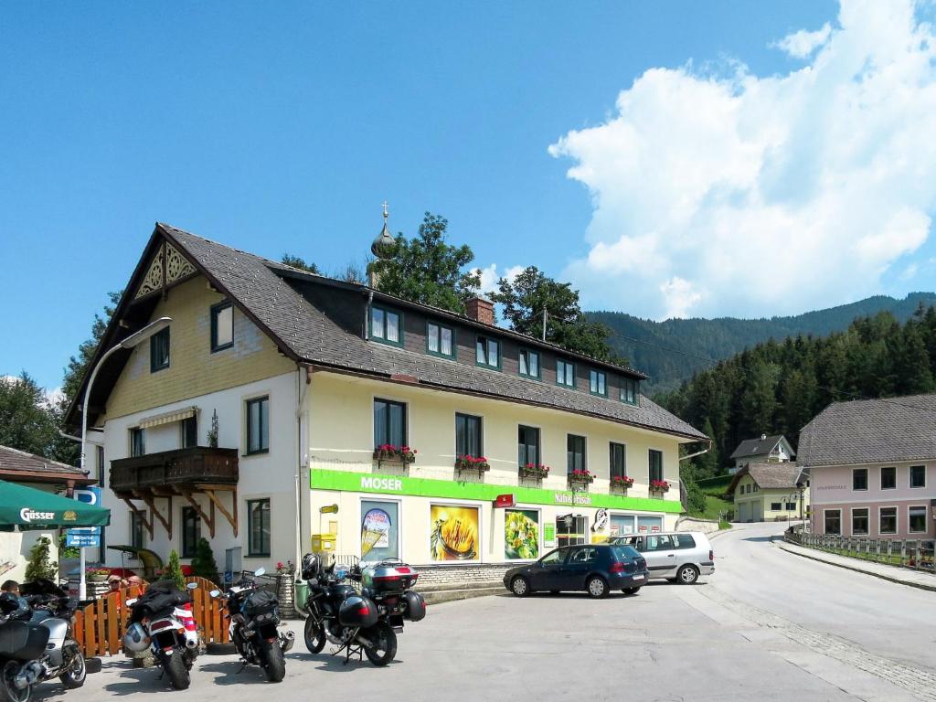 a group of motorcycles parked in front of a building at Apartment Moser - STS270 by Interhome in Stein an der Enns