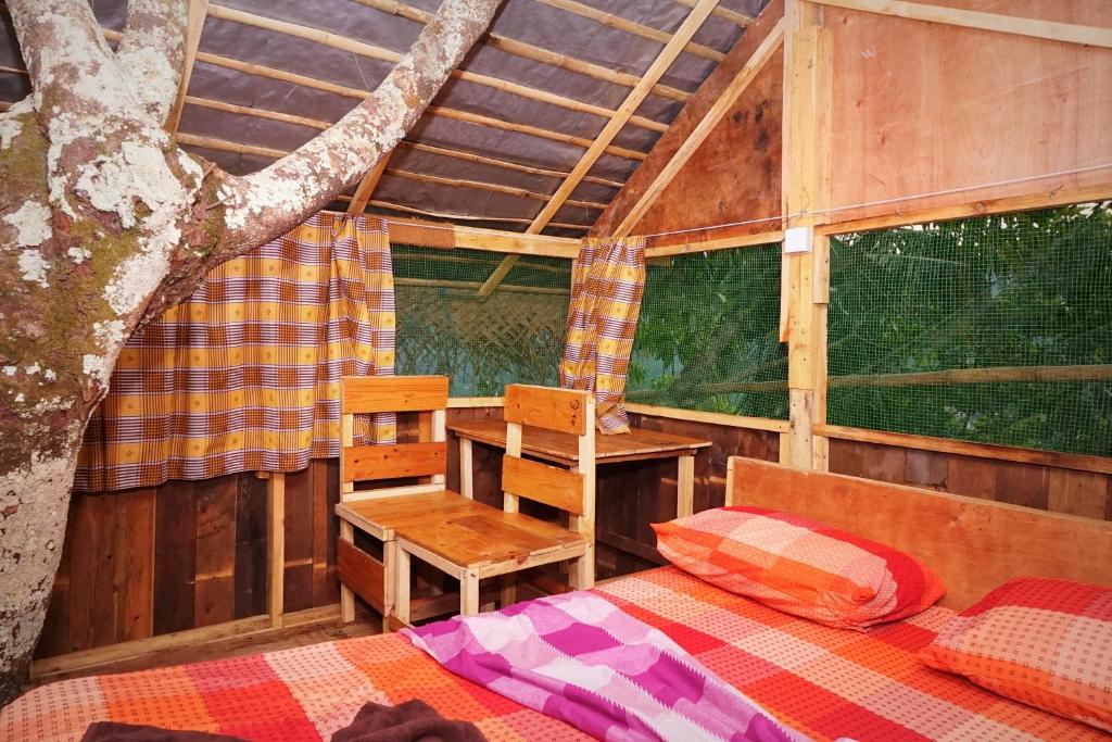 Postel nebo postele na pokoji v ubytování Kandy Nature Resort