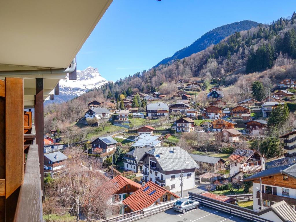 a view of a town in the mountains from a house at Apartment Les Hauts de St Gervais-3 by Interhome in Saint-Gervais-les-Bains