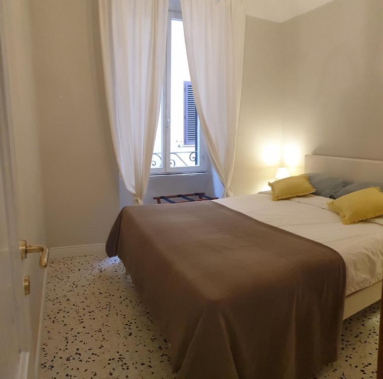 A bed or beds in a room at Casa Tua a Santa Maria Maggiore