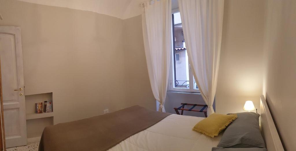 A bed or beds in a room at Casa Tua a Santa Maria Maggiore