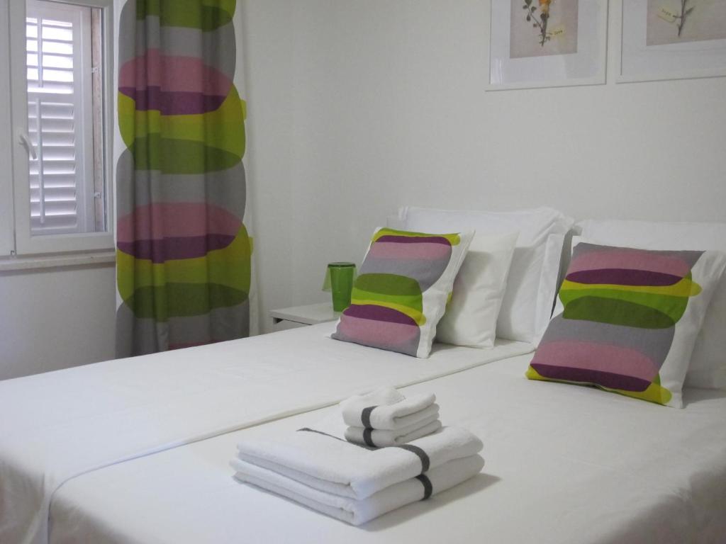 Posteľ alebo postele v izbe v ubytovaní Fiorino Rooms Korčula
